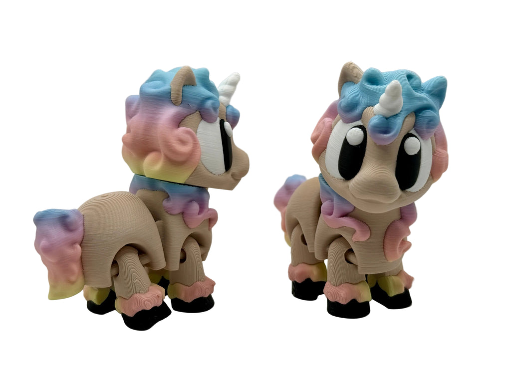 Two colorful unicorn figurines on a light gray background