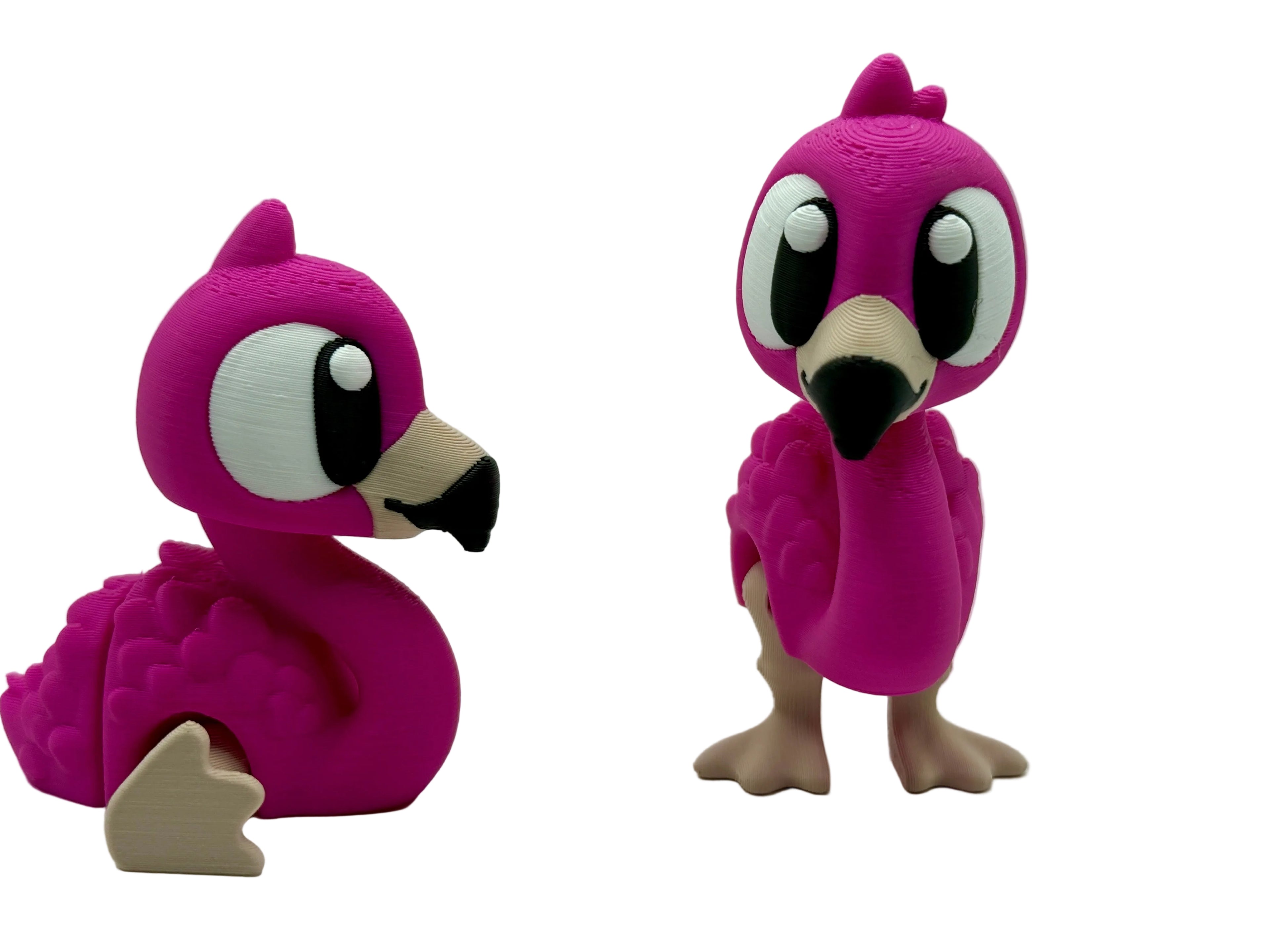 Two pink bird-like figurines on a white background