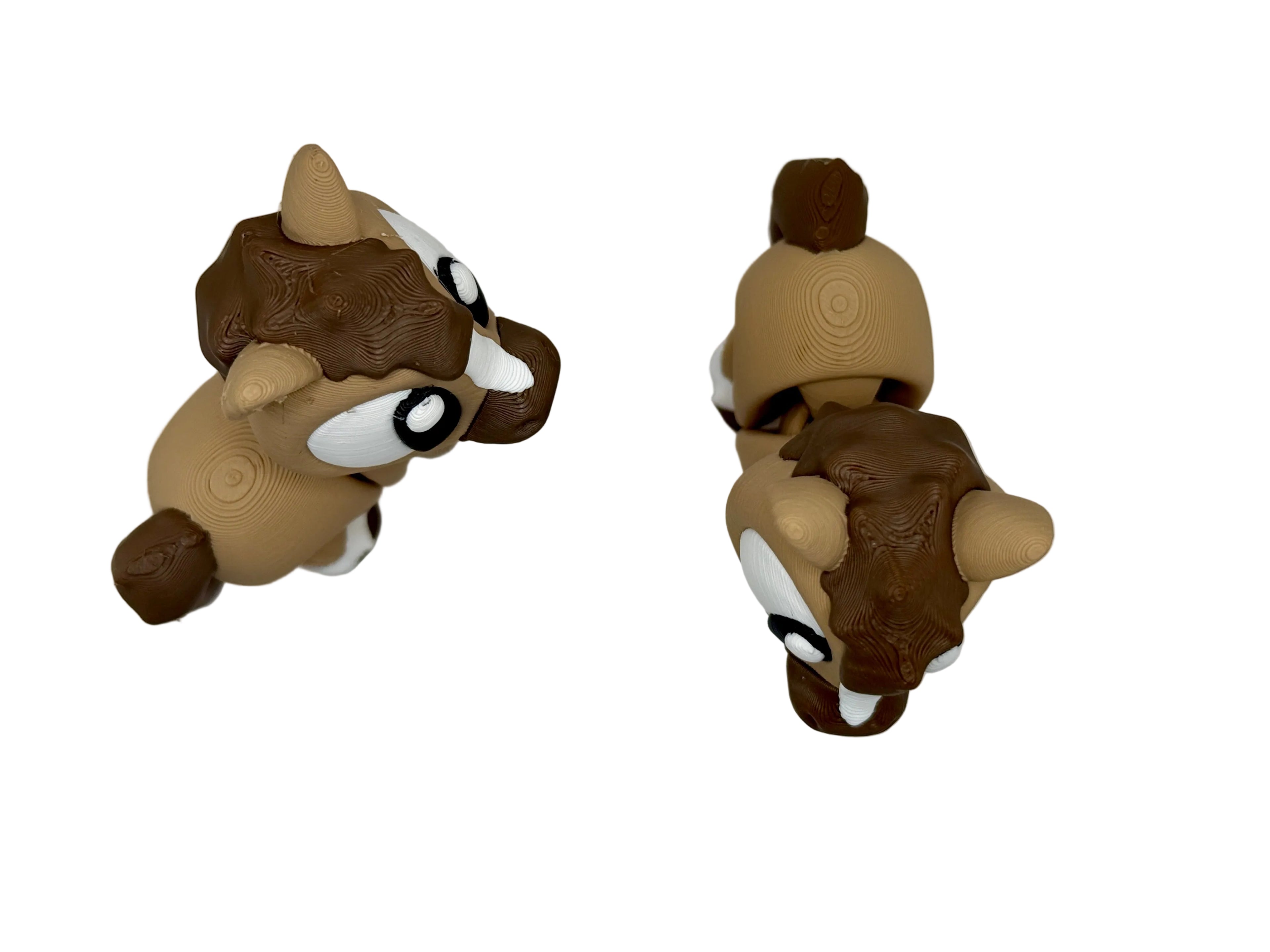 Two toy figures of horses on a white background