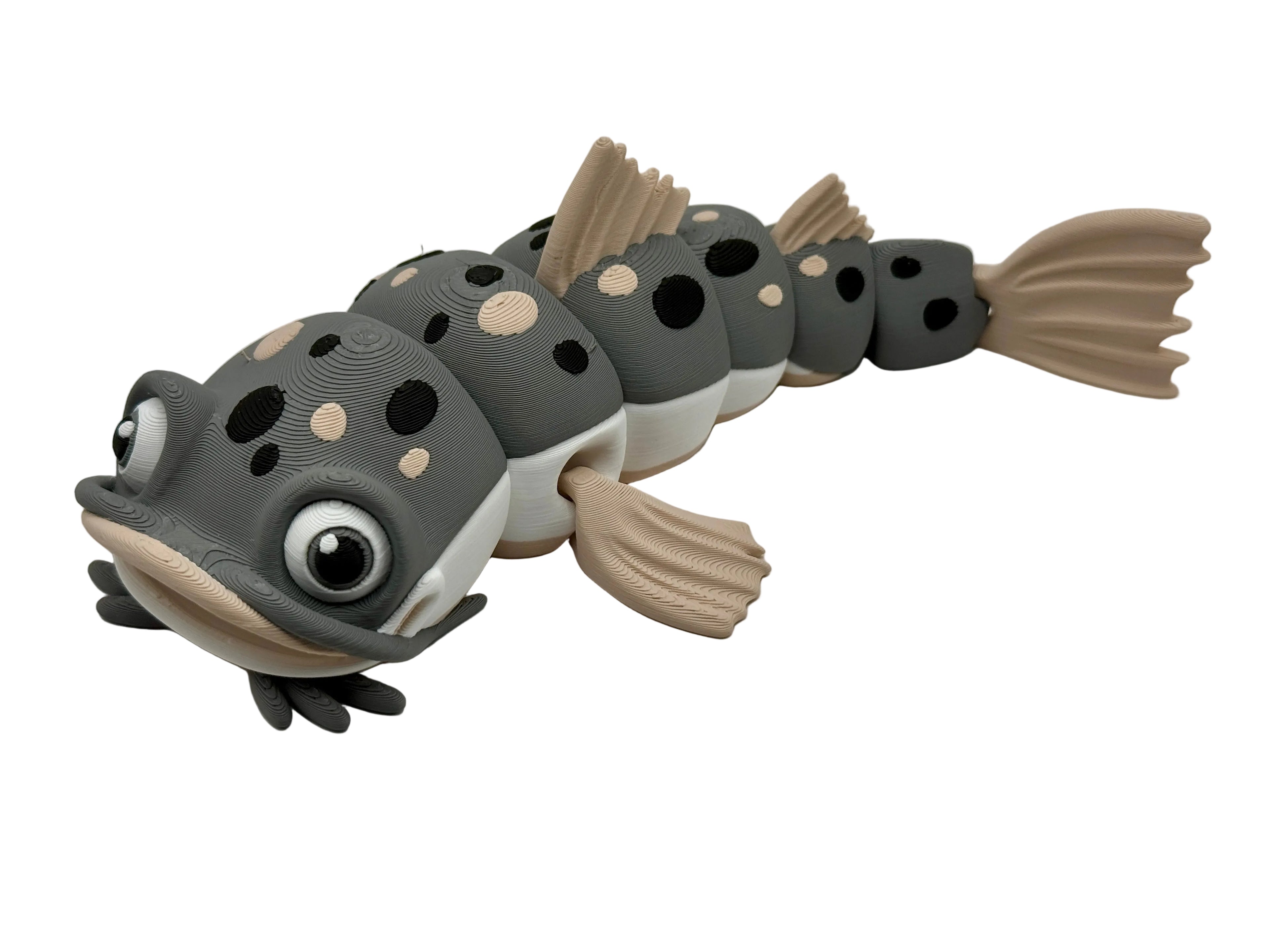 Toy resembling a catfish with gray and beige colors on a white background